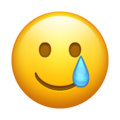 emoji visage souriant avec larme